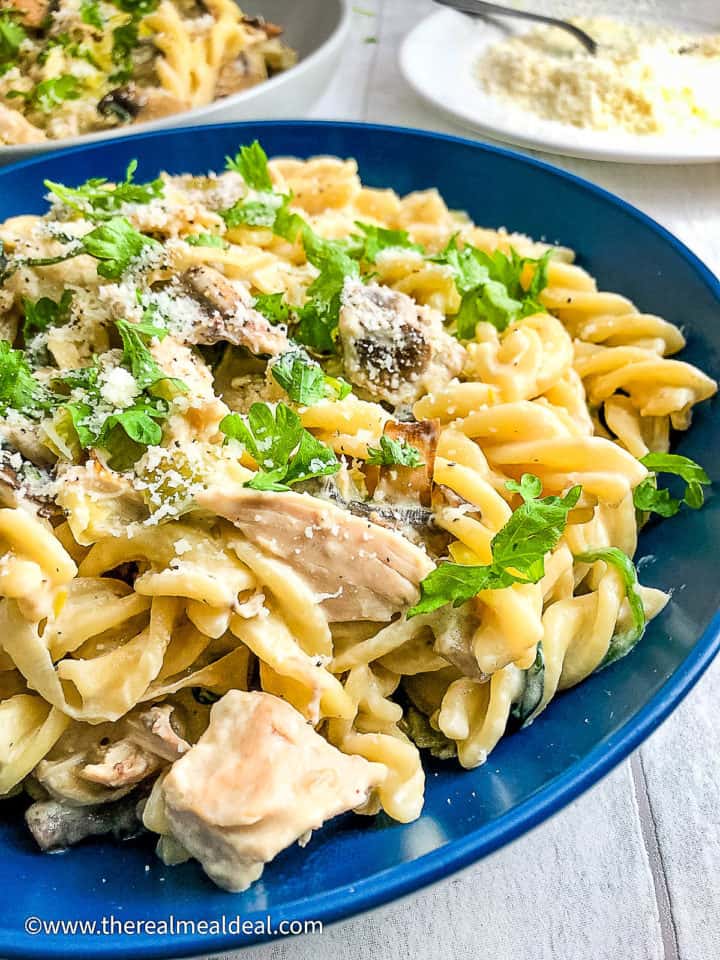 close up of chicken leek and mushroom pasta in bowl